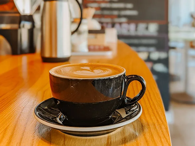 A cup of coffee placed on the table