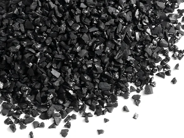 A pile of black coconut shell activated carbon filter material