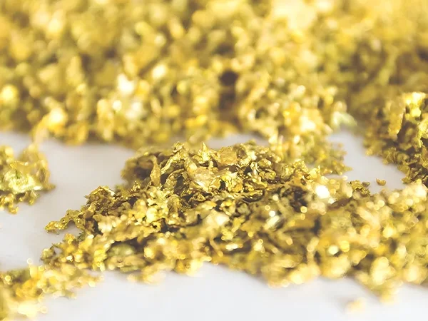 A pile of golden KDF filter material