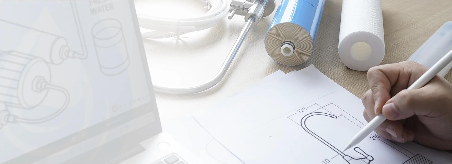 A tablet, many water purifier components and drawings are displayed.
