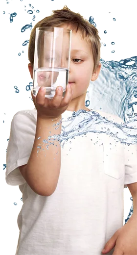 A kid is looking at a water cup held in their hand.