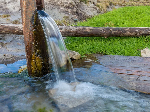 Water flowing from a pipe into a river