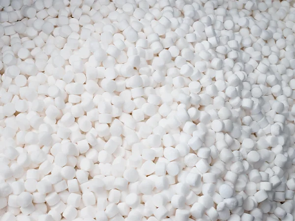 Many white softener salt blocks piled together